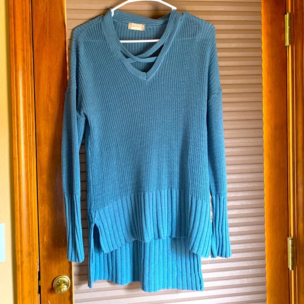 Adorable sweater, blue grey, comfortable and girly. Great quality. Size small.